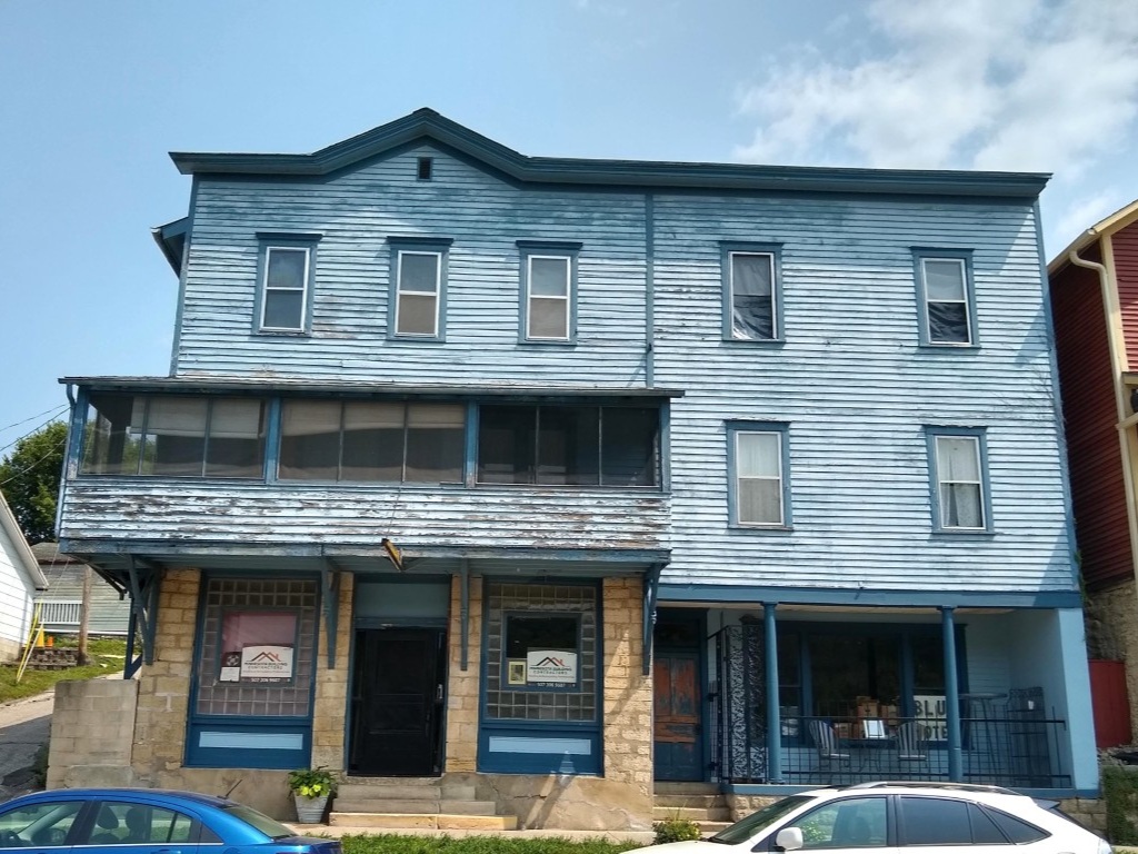 blue-hotel-lanesboro-mn-before-front-elevation-old-wood-siding-windows.jpg (1)